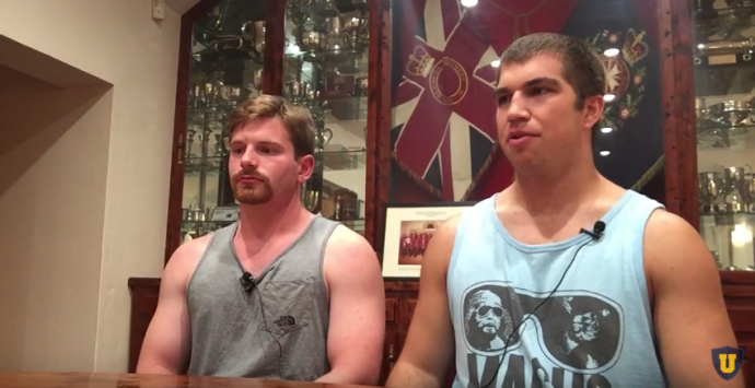 Two Texas players sitting at a table